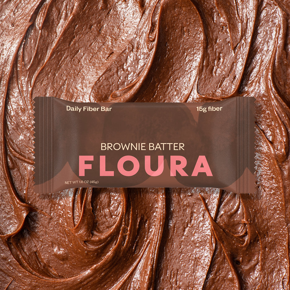 Floura Brownie Batter fiber bar packaging on a chocolate background hide-from-pdp